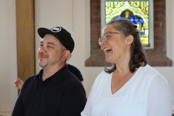 Kerri McGonigle and Felix Deák, smiling and laughing